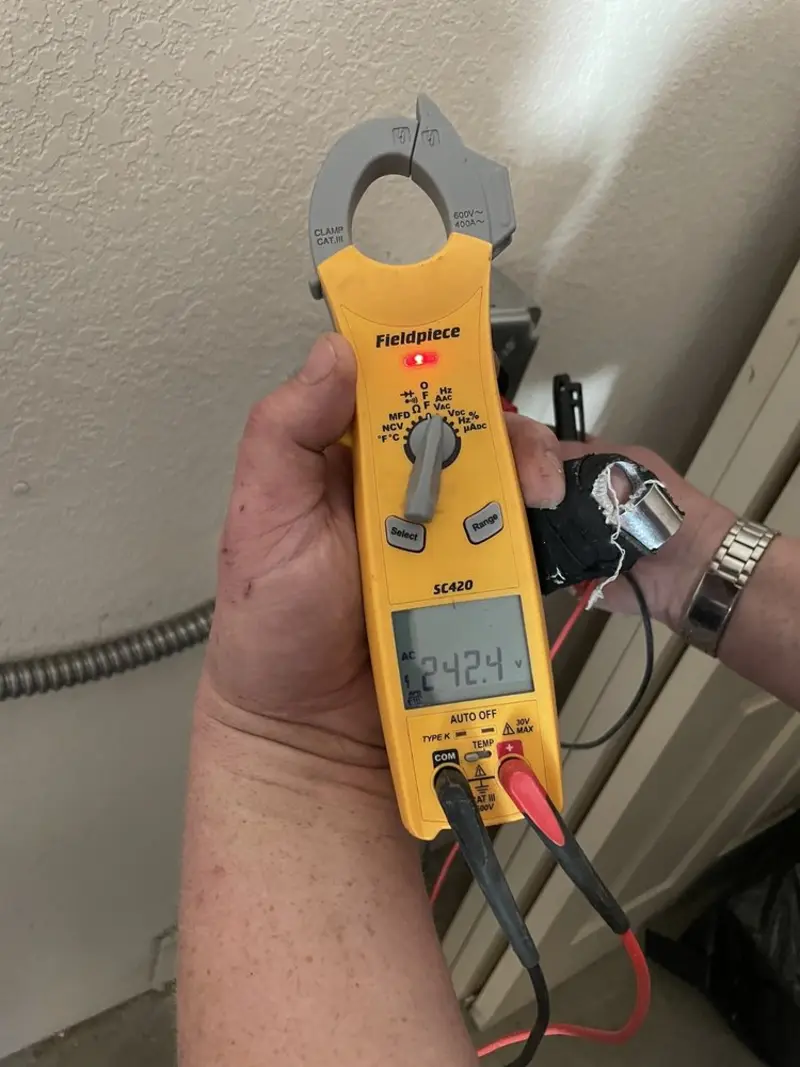 Voltage testing with clamp meter during Recessed Lighting Installation in Versailles